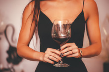 Close Up Hands Of Woman With Wine Glass