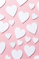 Wall Mural - White hearts on a pastel pink background. Valentine's day, Mother's day background