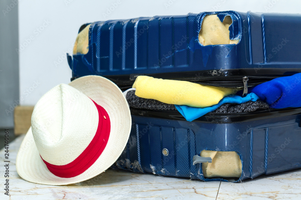 Traveling suitcase damaged at the airport. Broken luggage wheel