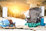 Fototapeta  - Winter time and backpack on stone. Free space for your decoration. 