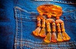 © sergei_fish13 - Decorative coulomb of Baltic amber on denim background