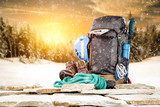 Fototapeta  - Winter composition of backpack and mountains landscape 