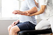 A Modern rehabilitation physiotherapy worker with senior client