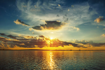 Wall Mural - sunset sky with clouds above lake, tourist attraction nong han lake at sakon nakhon province in thai
