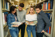 © Aleksandr - Group of student want to find some helpful literature to preparing for university exam