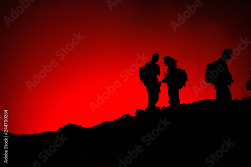 Unrecognized Tourists S Silhouettes On Erta Ale Volcano Edge