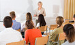 © JackF - Mature female giving presentation for students