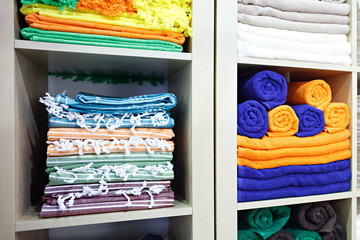 Leinwandbilder - Fresh White and colorful Hotel Towels Folded and Stacked on a Shelf