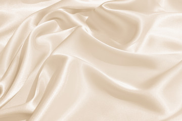 Wall Mural - The texture of the satin fabric of beige color for the background