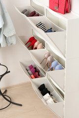 Sticker - Shoe cabinet with footwear in room. Storage ideas