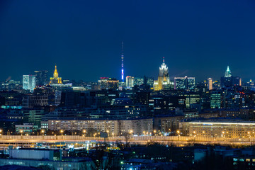 Wall Mural - Night city landscape. Moscow, Russia. Ostankino tower on the horizon. Street lights.