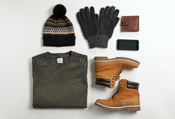 flat lay composition with male winter clothes on white background