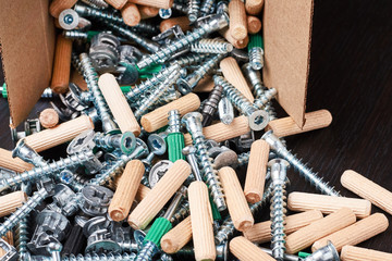 Open box with fall out tools for a furniture assembly, closeup