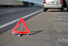Closeup Of Warning Triangle On Roadside