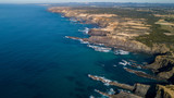 Fototapeta  - Aerial view of the Cabo Sardao cliffs and Waves Atlantic coast Portugal
