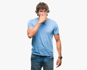 Sticker - Handsome hispanic model man over isolated background shocked covering mouth with hands for mistake. Secret concept.