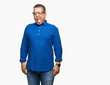 © Krakenimages.com - Middle age arab man wearing glasses over isolated background sticking tongue out happy with funny expression. Emotion concept.