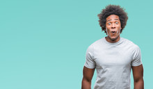 Afro American Man Over Isolated Background Afraid And Shocked With Surprise Expression, Fear And Excited Face.