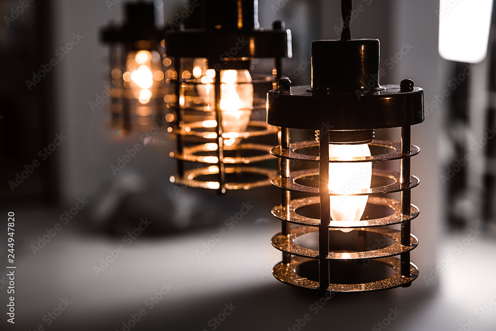 Stylish glowing lamps in room