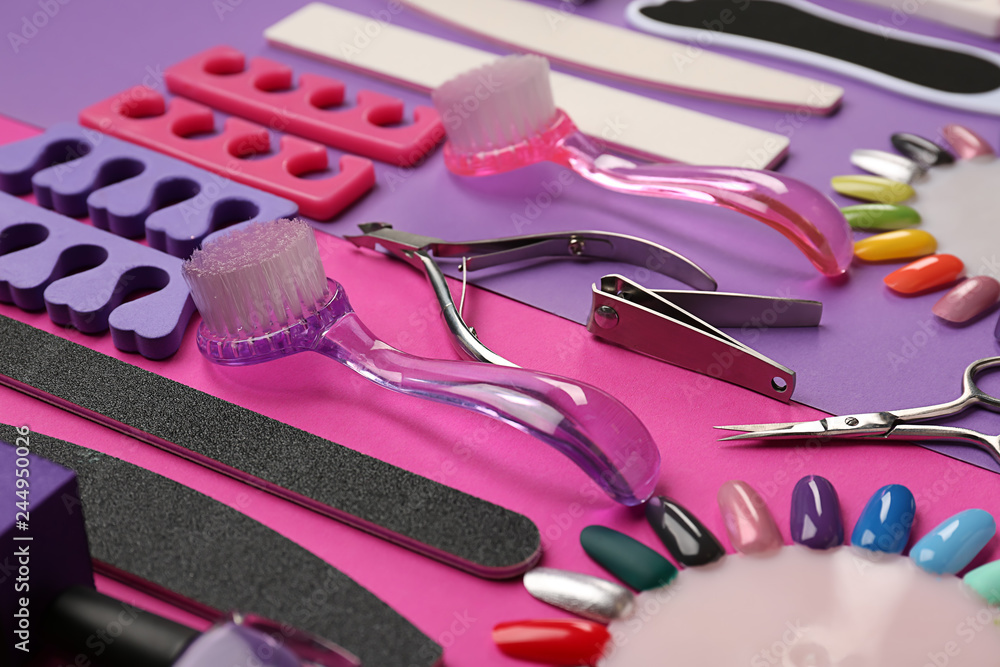 Set of professional tools for pedicure on color background
