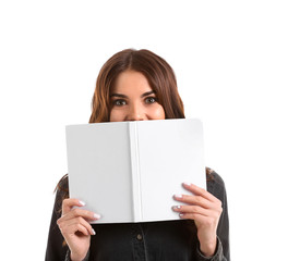 Wall Mural - Beautiful young woman with book on white background