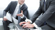 © ASDF - close up. business partners discussing the terms of the contract