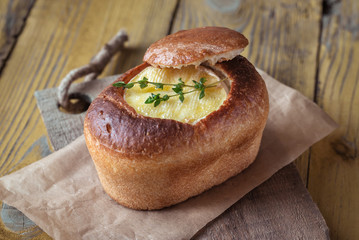 Poster - Camembert bread bowl on the wooden background