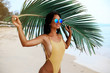 © Nabokov Alex - incredibly beautiful sexy girl models in a bikini on the sea shore of a tropical island with palm leaf, blonde brunette, bronze tan, travel summer vacation, fashion style