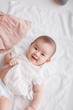 © lichaoshu - Asian cute baby photography in the studio,Shot from overhead on a white background.