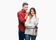 © Krakenimages.com - Young couple in love wearing winter sweater over isolated background with hand on chin thinking about question, pensive expression. Smiling with thoughtful face. Doubt concept.