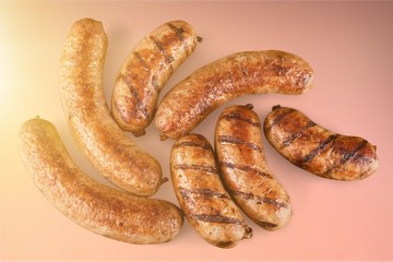 Wall Mural - Roasted sausages on white background