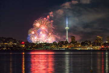 Lake Union 4th of July Fireworks and the Seattle skyline, as seen from across Elliott Bay at Seacrest Park in West Seattle