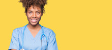 Young African American Doctor Woman Over Isolated Background Happy Face Smiling With Crossed Arms Looking At The Camera. Positive Person.