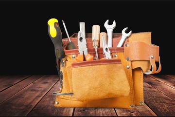 Wall Mural - Tool belt with tools on light background