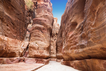 Wall Mural - The road between the red rocks of the Siq gorge to the ancient city of Petra, Jordan