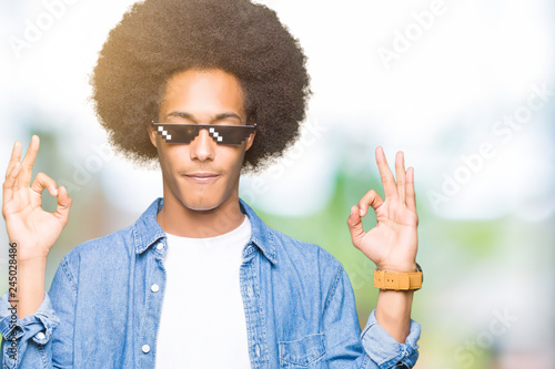 Young African American Man With Afro Hair Wearing Thug Life