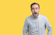 © Krakenimages.com - Handsome middle age elegant senior man wearing glasses over isolated background afraid and shocked with surprise expression, fear and excited face.