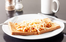 Baked Beans On Toast Topped With Grated Cheese