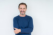© Krakenimages.com - Elegant senior man over isolated background happy face smiling with crossed arms looking at the camera. Positive person.