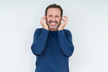 Wall Mural - Elegant senior man over isolated background covering ears with fingers with annoyed expression for the noise of loud music. Deaf concept.