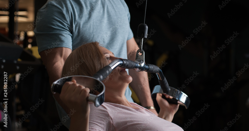 Exercise Execution Close-up - A male personal trainer observe the execution of an exercise ...