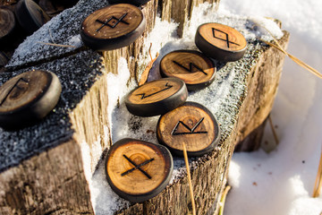 Wall Mural - Runes carved from wood on the snow - Elder Futhark
