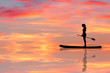 stand up paddling board at sunset