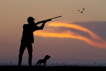 Poster - man hunting with the dog at sunset