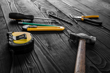 Set of different building equipments on the wooden table