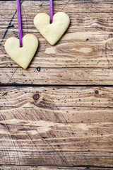 Heart shaped cookies for valentine's day on wooden background. Copy space