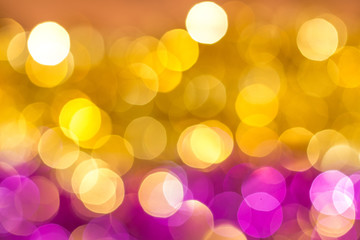 Abstract background in warm colors with bright  luminous orange and pink bokeh_