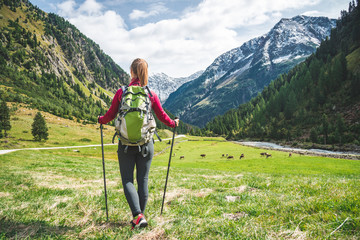 Wall Mural - young woman hiking in the mountains