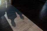 Fototapeta Perspektywa 3d - Silhouettes and Shadows of People on the floor with open Door