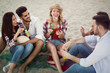 © NDABCREATIVITY - Group of cheerful friends having great time at beach